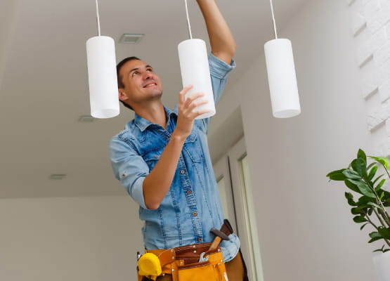 handyman installing lights